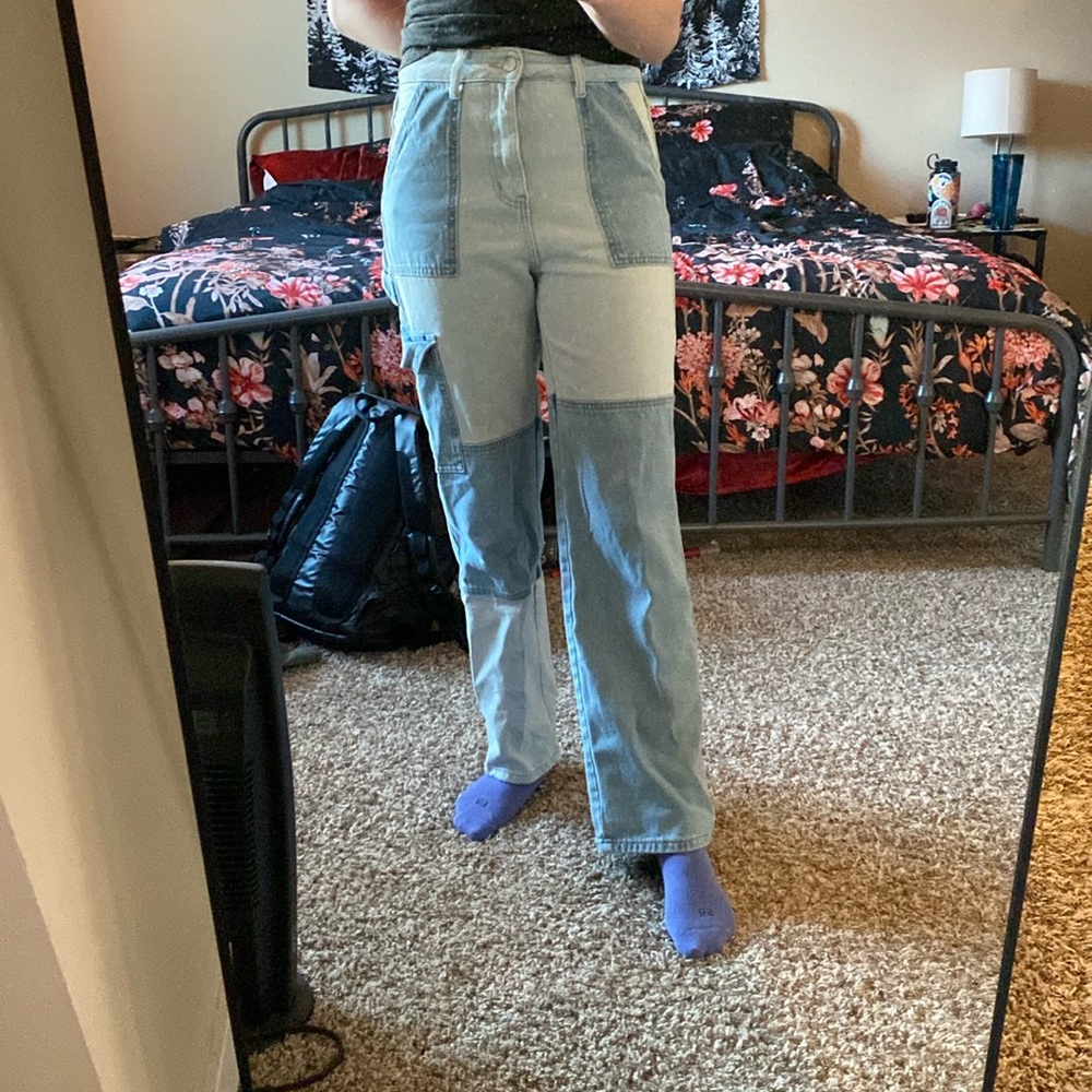 Pair of jeans with color block sewing.